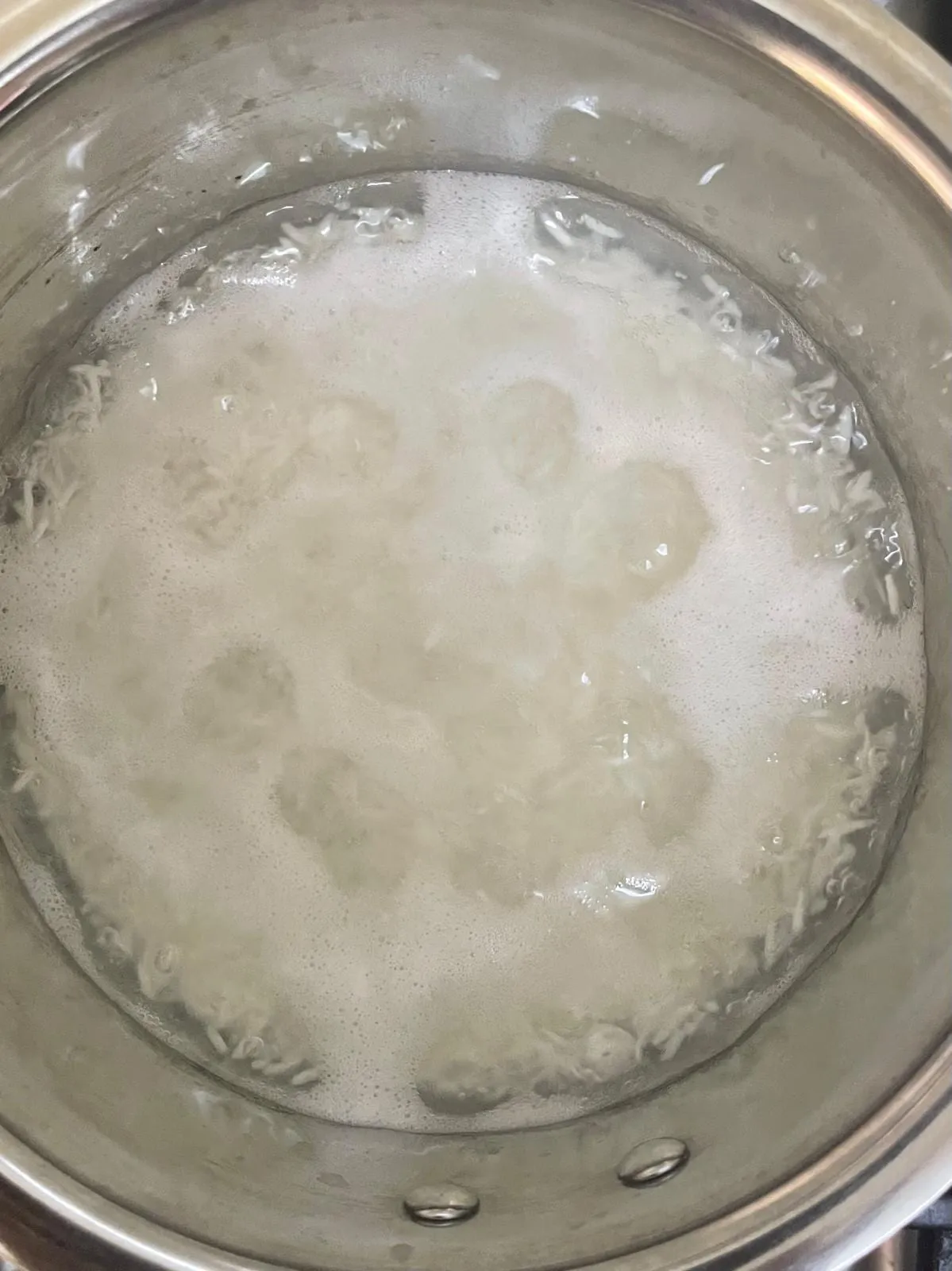 Step 1: Add the rice and water to a pot. Set it on the stove over medium heat and bring it to a bo