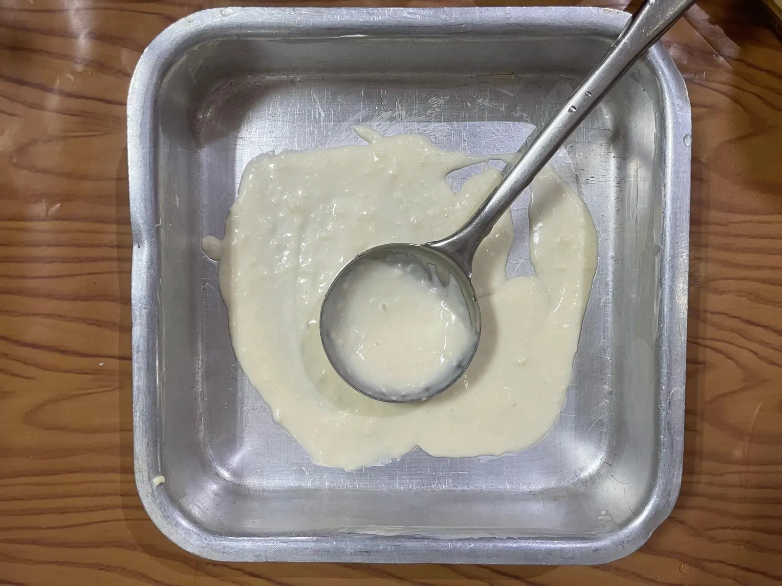 Step 2: Spread a thin layer of lasagna sauce over the bottom of the dish. This helps prevent the l
